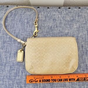 Coach signature C metallic gold wristlet purse